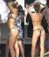 组图：超模坎蒂丝拍摄现场曝光 豹纹泳衣现野性