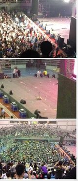 现场组图：张信哲梁静茹演唱会被扔水瓶凳子