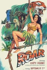 组图：佩里化身森林女王秀乳沟 与猛虎对吼威武